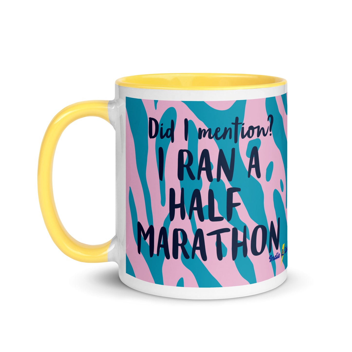 yellow handled mug with pink and blue tiger print, and the phrase did i mention? I ran a marathon in a bold font